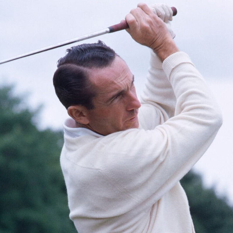 Dow Finsterwald swinging a golf club.