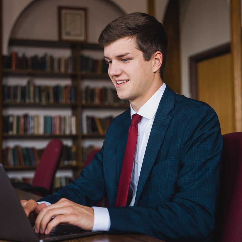 Trent Hoekstra works on his laptop.