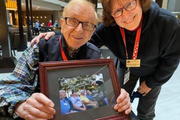 David Bailey, West Virginia '43, shows a photograph