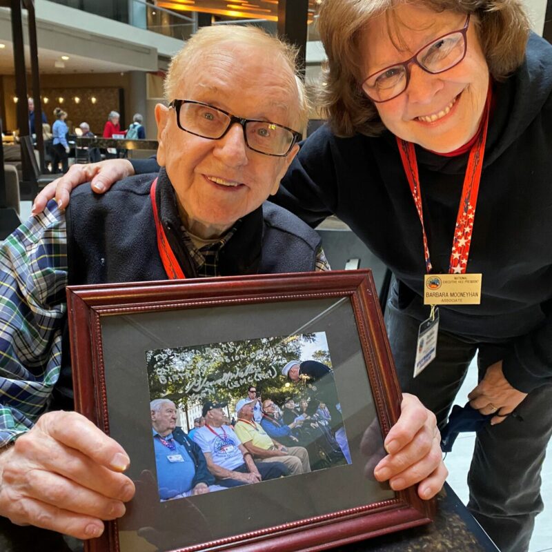 David Bailey, West Virginia '43, shows a photograph