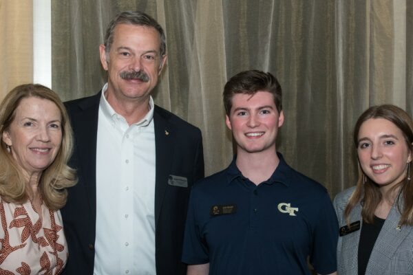 Colin Burnett (third) stands with Astronaut Scott Altman (second) and his wife (first)