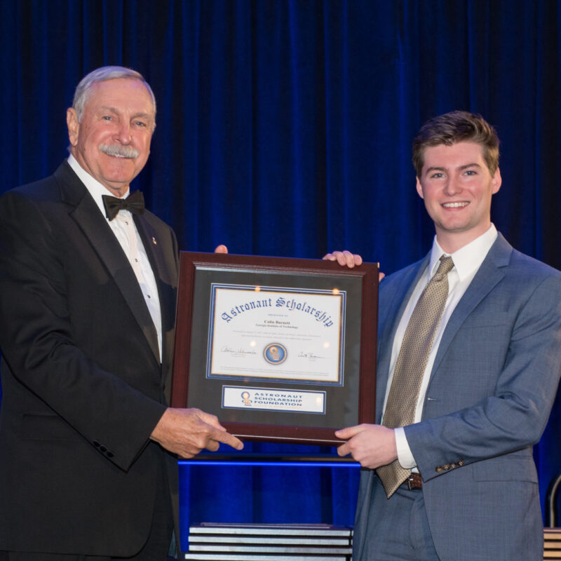 Colin Burnett, Georgia Tech '23, receives his award for being selected for the Astronaut Scholarship from astronaut and ASF Chairman Curt Brown.