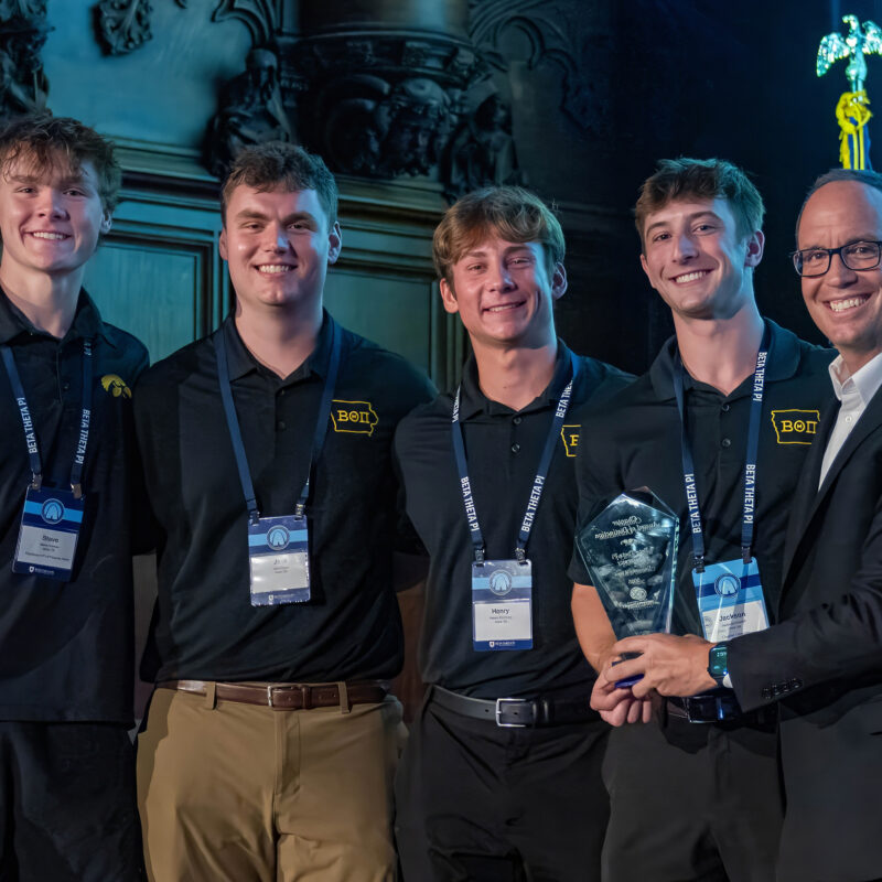 North American Interfraternity Conference CEO Judd Horras, Iowa State ’97, (far right) presents the NIC Chapter of Distinction Award to four members of the Iowa chapter.